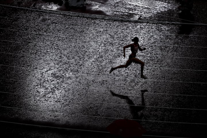 TOKYO, JAPAN - AUGUST 02: Lea Sprunger of Team Switzerland competes in the rain during the women's 400 metres semifinal on day ten of the Tokyo 2020 Olympic Games at Olympic Stadium on August 02, 2021 in Tokyo, Japan. (Photo by Patrick Smith/Getty Images) *** BESTPIX ***